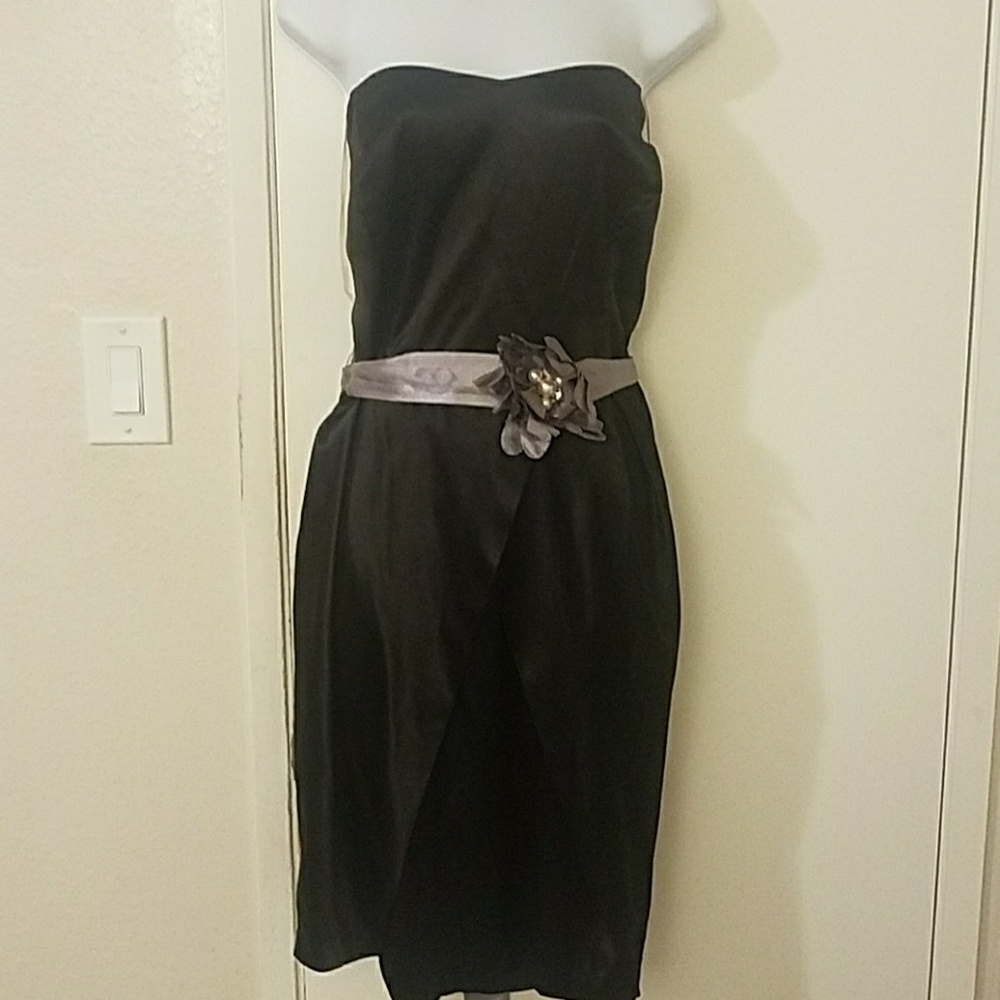 Black  strapless dress with a silver belt & flower